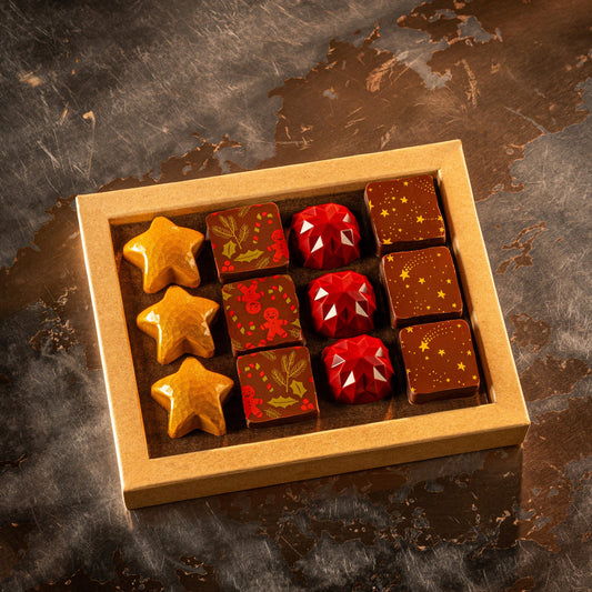 Assorted chocolates in a wooden box on a textured surface