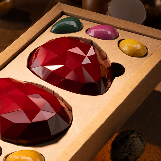 Two Fabergé Easter eggs with garnish