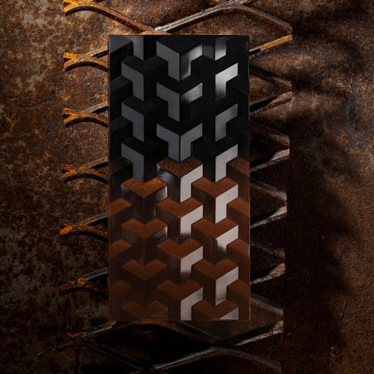 Brown chocolate bar with geometric patterned on a textured brown background