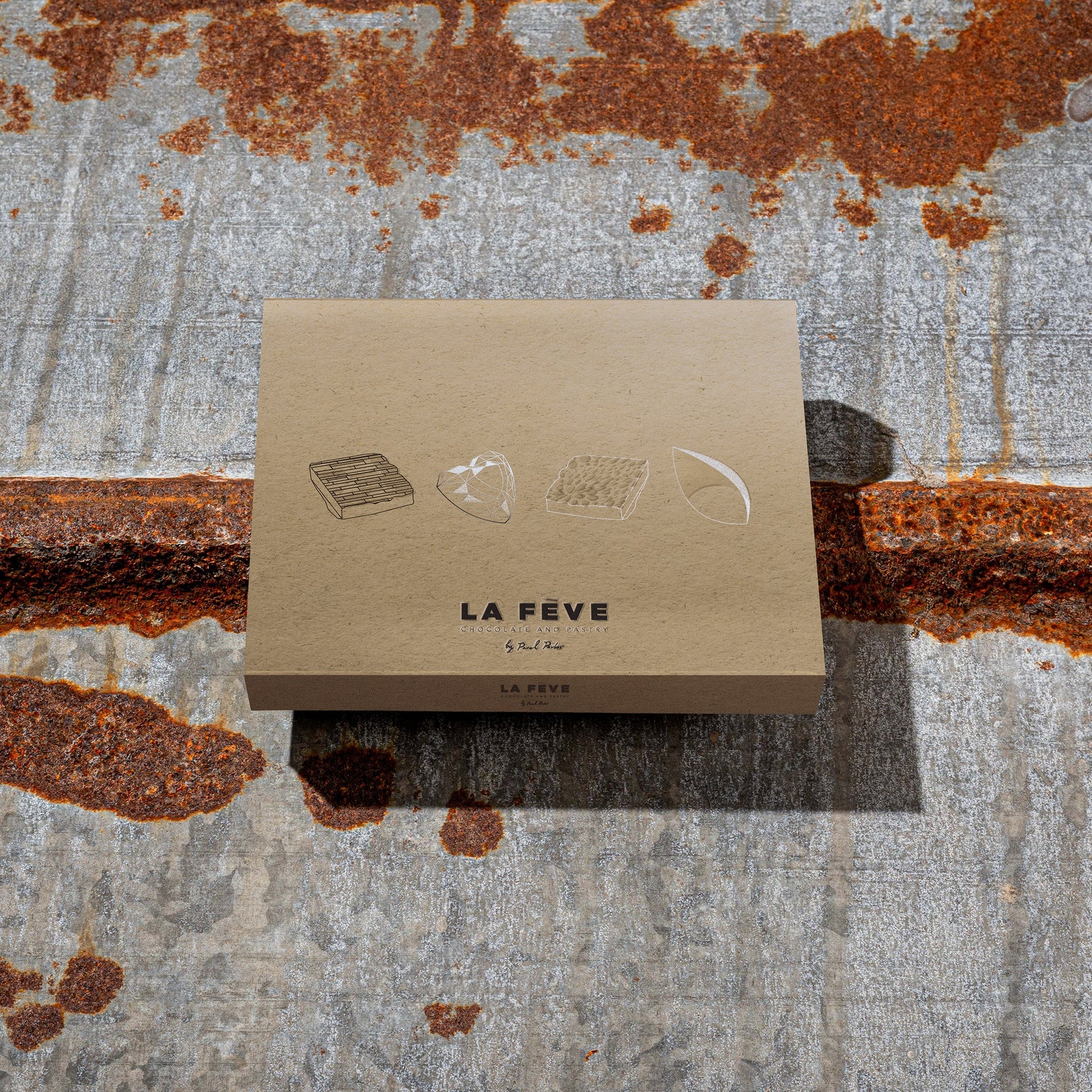 La Feve eco-friendly kraft paper packaging on a textured metal background