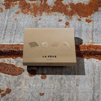 La Feve eco-friendly kraft paper packaging on a textured metal background