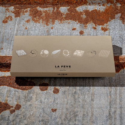 La Féve eco-friendly kraft packaging on a textured metal background